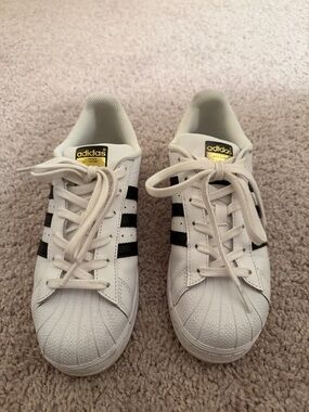 adidas White Sneakers with Black Stripes and Gold Logo